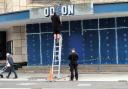 Workers taking down the Odeon sign in Weston-super-Mare