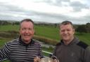 Les Byrne (left) and Gareth Davies (right) with The John Smith Trophy at Brean Golf Club.