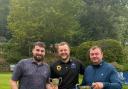 Captain Luke Gaskins (Brickhampton Court) presenting club colleague Langdon (centre) with Ed Goodwin (Vice Chairman) assisting (right)