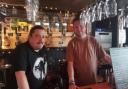 Nick Smith (left) and Alistair Lodge, member of staff, behind the bar