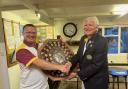 Banwell’s Captain Chris Wilson (left) presenting the shield to a beaming Winscombe Captain Chris Bryant.