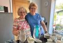 Angela and Sonia serving the afternoon tea during the charity's meeting