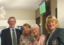 John and Alison Whitewood with Sally Irlam presenting the trophy and lady captain Jackie Read