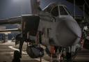 An RAF Tornado sitting on the pan with two Storm Shadows underneath it (Cpl L Matthews/PA)