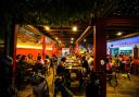 Foreign tourists have a drink at a night club at Nana Backpack hostel in Vang Vieng, Laos (AP/Anupam Nath)