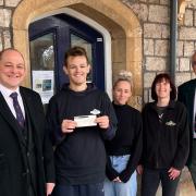 Garry Sharp and Ray Beckingham of the lodge present a cheque to café manager Zoe Barker, Sally Wilcock and Ryan Taylor of the cycle project.