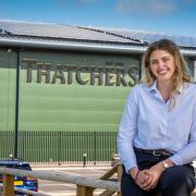 Eleanor Thatcher at Myrtle Farm pictured in front of the newly installed solar panels.