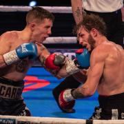 Dean Dodge and Danny Carr in action during their Southern Area super-featherweight title fight at Bolton Whites Hotel last February.