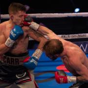 Dean Dodge and Danny Carr in action during their Southern Area super-featherweight title fight at Bolton Whites Hotel.