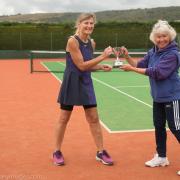 Cheddar Tennis Club Ladies winner Juliet Knight (left) with Sarah Strawbridge presenting the trophy.