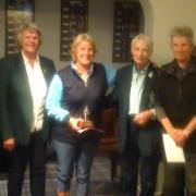 Cathy Olive, winner of the MacArthur Trophy presented by Marion MacArthur alongside ladies captain Helen Tanswell and runner-up Lyn Bird.