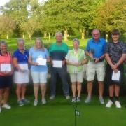 Jeff Bulcock holding the Yonex Trophy along with other prize winners following this week's Yonex Open at Wedmore.