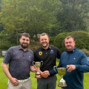 Captain Luke Gaskins (Brickhampton Court) presenting club colleague Langdon (centre) with Ed Goodwin (Vice Chairman) assisting (right)