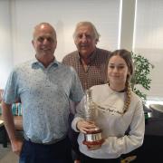 Left to right: Paul, Richard and Isla celebrate the family's success