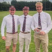 Hornets players Hayden Tuttiett, Charlie Carter and youngster Jamie Elswood receive their awards