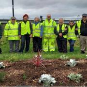 Burnham and Highbridge Growing Group volunteers with the Esplanade flower beds.