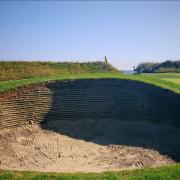 The walls of the bunkers on 7th have been revetted with synthetic material