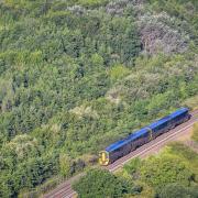 A GWR train on the railway heading out of Bristol towards North Somerset, across the green belt.