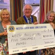 Weston Lions present two charities with £10,000 donation