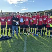 Dave Channing presents the September team of the month to Clevedon Utd A