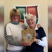 Weston lady captain Jackie Read presenting the shield to her Worlebury counterpart Sarah Tyler