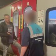 Footage shot on September 7 shows the man with one foot on the Transport for Wales carriage's step