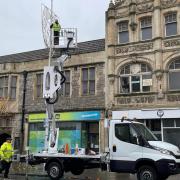 Christmas lights with a new design are being installed in Weston