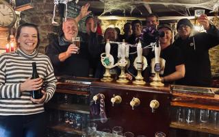 Emma Lomas in the pub with a group of customers